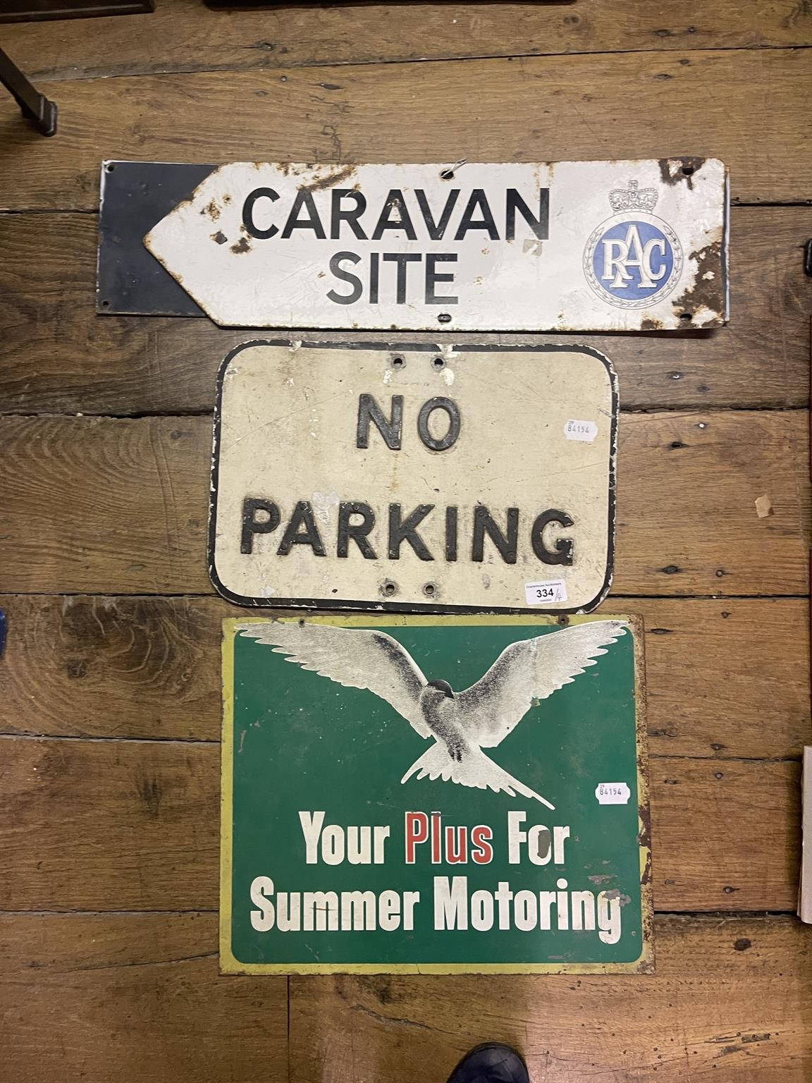 An enamel double sided finger sign, RAC Caravan Site, 16.5 x 56 cm, and aluminium No Parking sign,