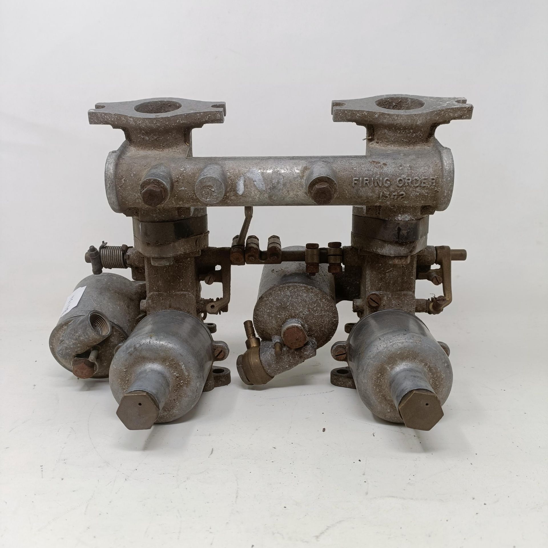 A pair of 1 1/4 inch SU carburettors, 6 inches between centres, on a manifold