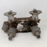 A pair of 1 1/4 inch SU carburettors, 6 7/8 inch between centres, on a manifold