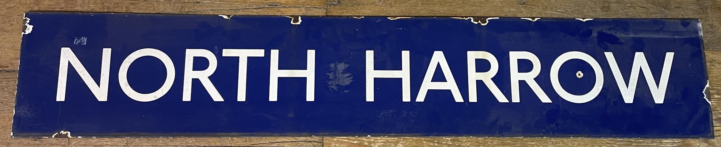 A London Underground enamel sign, North Harrow, 26 x 150 cm