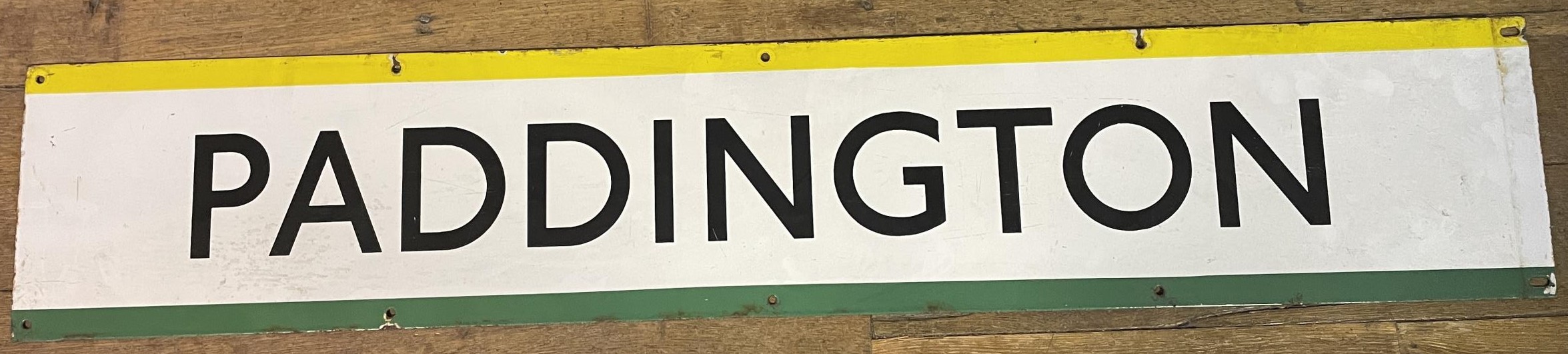 A London Underground enamel sign, Paddington, 23 x 127 cm