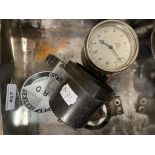 A Smiths dashboard clock, an altitude meter, an HRD Vincent Owners Club badge and a a Humber 1900-