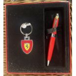 A Ferrari key ring, with a matching pen, boxed