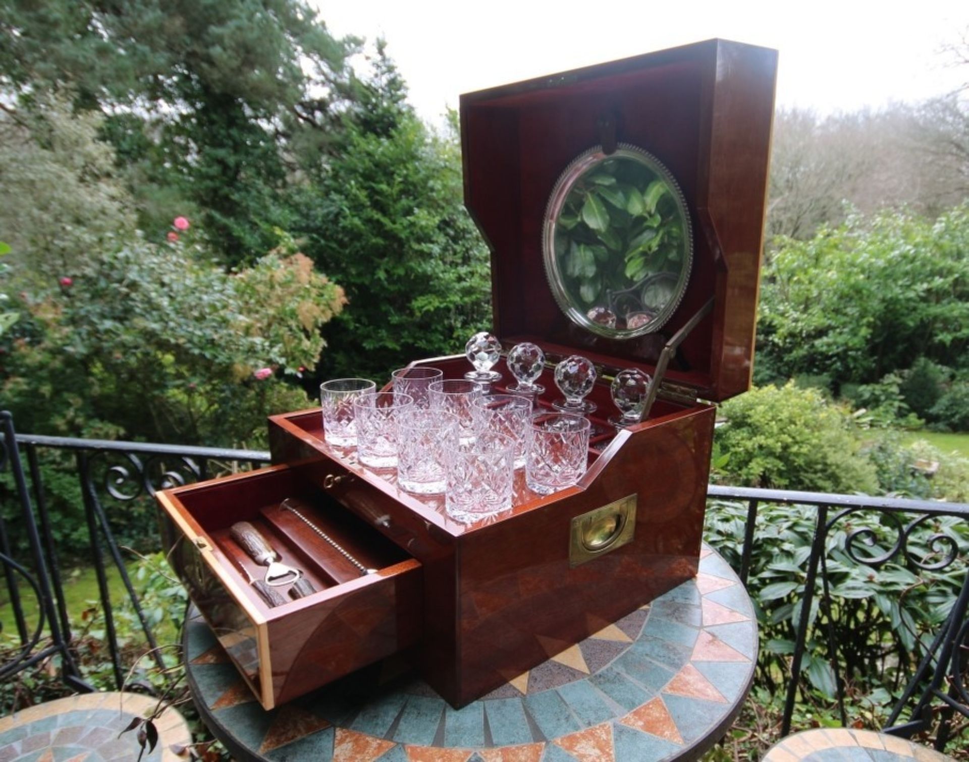 An impressive travelling cocktail set, for eight persons, with cut glass accessories, the mahogany