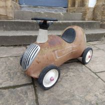 A child's push along racing car