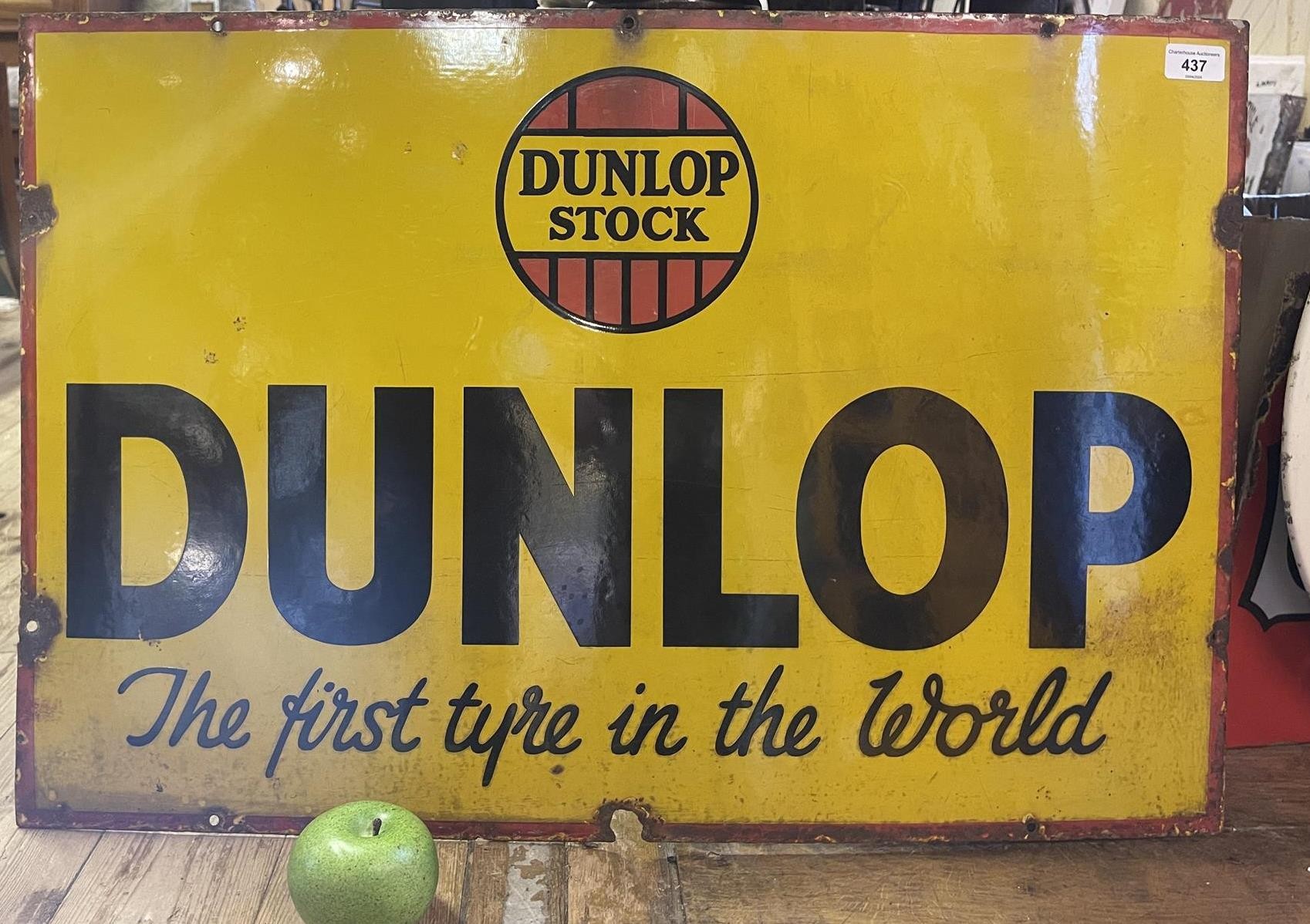 An enamel sign, Dunlop Stock Dunlop The First Tyre in the World, 51 x 76 cm Slight loss and damage