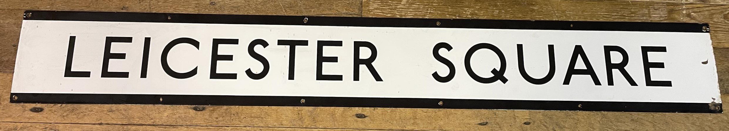 A London Underground enamel sign, Leicester Square, 23 x 170 cm