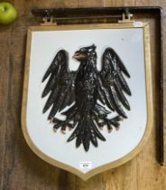 A bronze and painted Barclays Bank eagle sign, on a bracket, 48 cm wide (overall)