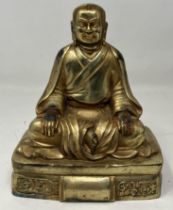 A gilt bronze Buddha height: 14 cm depth of base: 8.5 cm width of base: 12 cm weight: 965 g