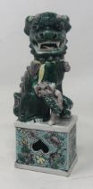 A Chinese famille verte Dog of Fo, 15 cm high Very minor loss, couple of firing faults