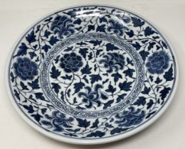 A Chinese blue and white charger, six character mark to base, 41 cm diameter generally good, no