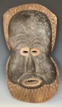 An African Cameroon type face mask, 64 x 34 cm
