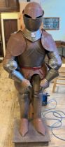 A 17th century style suit of armour, on a stand, 164 cm high some surface rust