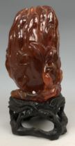 A Chinese amber vase, in the form of Buddhas hand form (finger citron), probably Qing Dynasty,