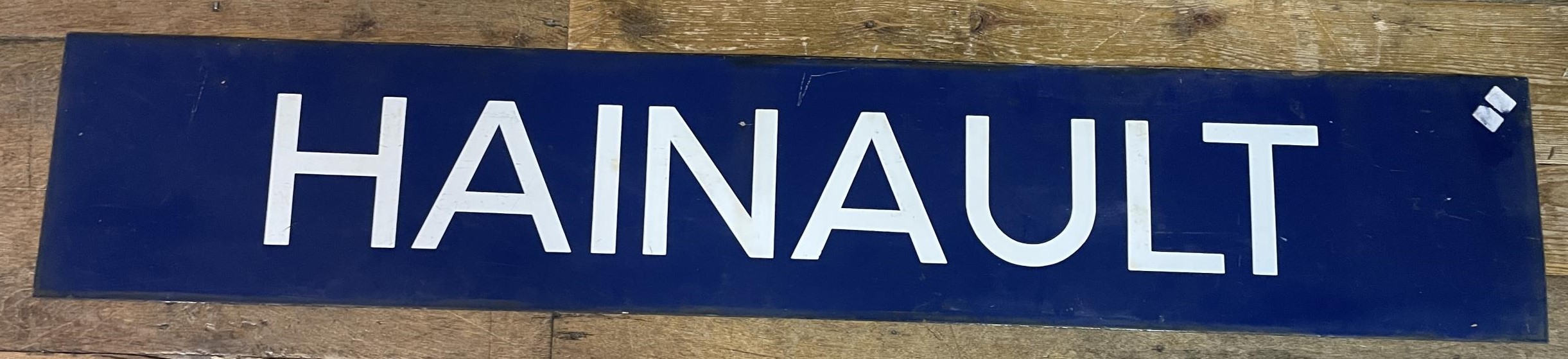 A London Underground enamel sign, Hainault, 27 x 149 cm