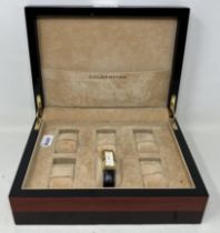 A Goldsmiths watch box, to hold six watches, 25.5 cm wide, a gentleman's stainless steel Rotary