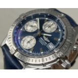 A gentleman's stainless steel Breitling Chronometre Automatic wristwatch, with a blue dial, on a