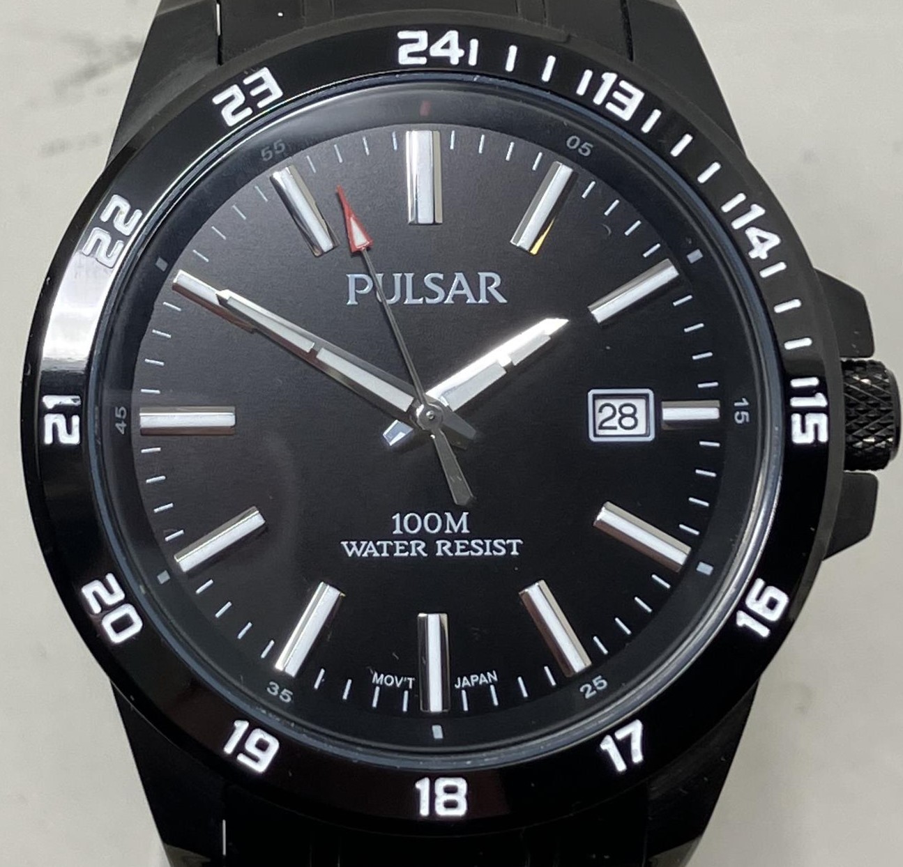 A gentleman's stainless steel Pulsar 100M water resist wristwatch, boxed, with instruction manual