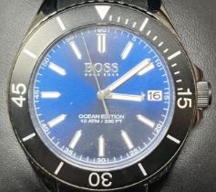 A gentleman's stainless steel Hugo Boss Ocean Edition wristwatch, boxed, with a warranty booklet and