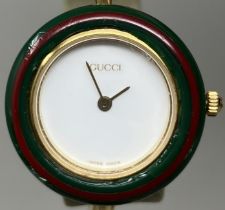A ladies Gucci wristwatch, boxed with 10 interchangeable bezels  watch is untested
