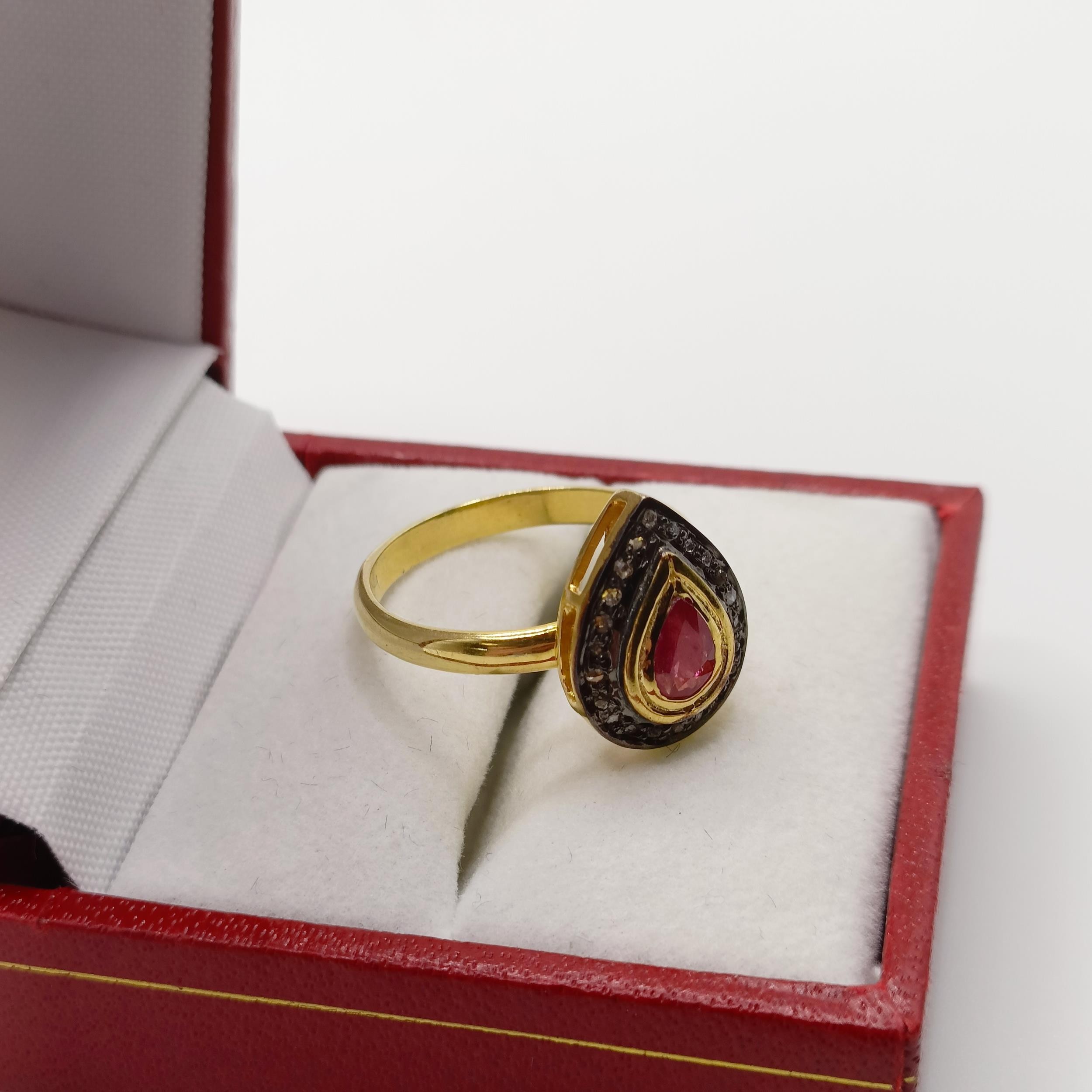 A pear shaped ring, set with pear shaped ruby and halo of R/C diamonds set in gold-plated silver, - Image 3 of 7