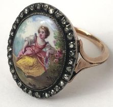 A late 19th century enamel and diamond ring, decorated a lady, ring size N