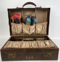 A vintage travelling shoe case, to include five pairs of ladies shoes
