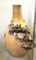 A Chinese stoneware vase, decorated dragons, 38 cm high