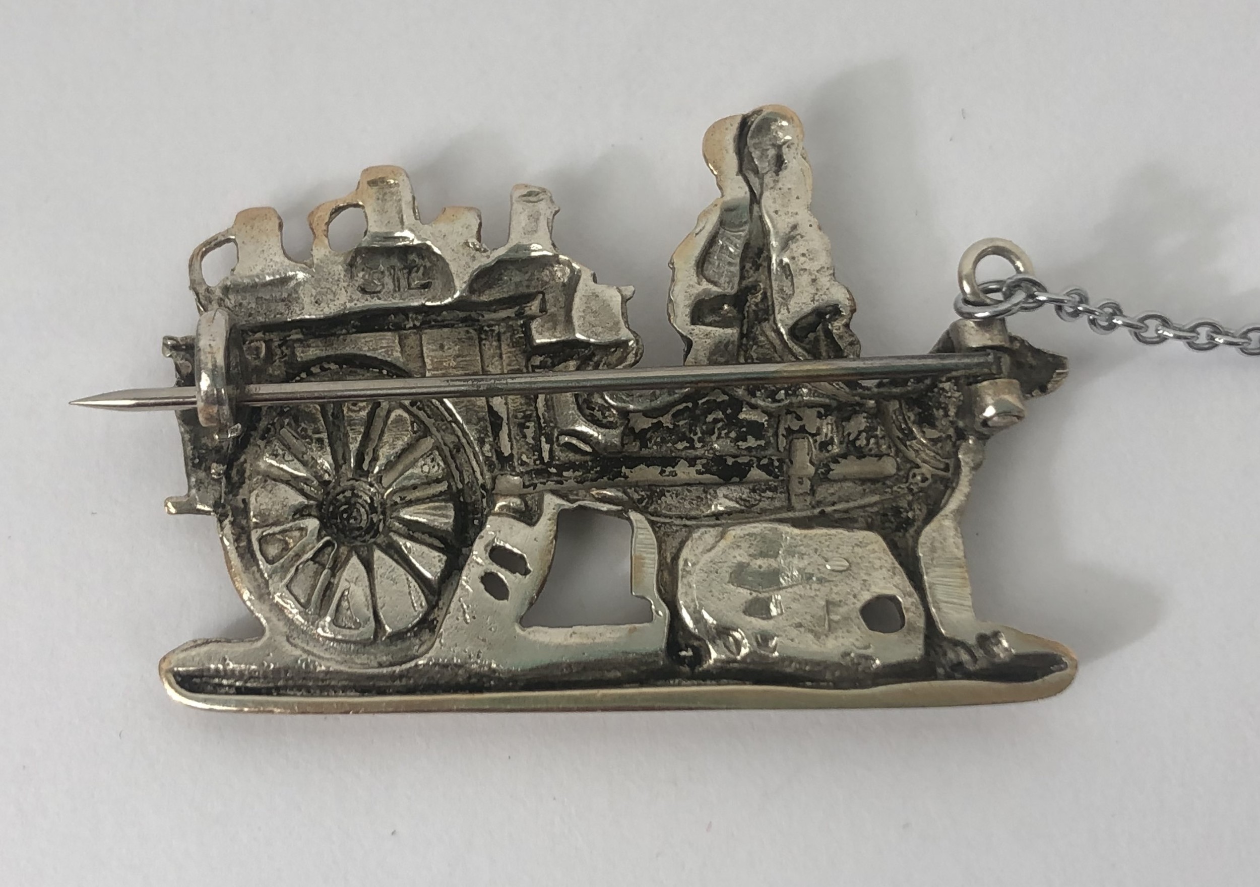 A silver coloured metal brooch, in the form of a lady with a dog cart - Image 3 of 4