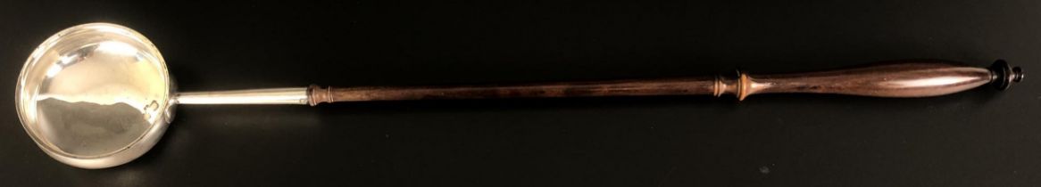 A William IV silver toddy ladle, with a turned wooden handle, Glasgow 1836