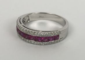 An 18ct white gold, three row ruby and diamond half eternity ring, square step-cut rubies 1.09ct R/C