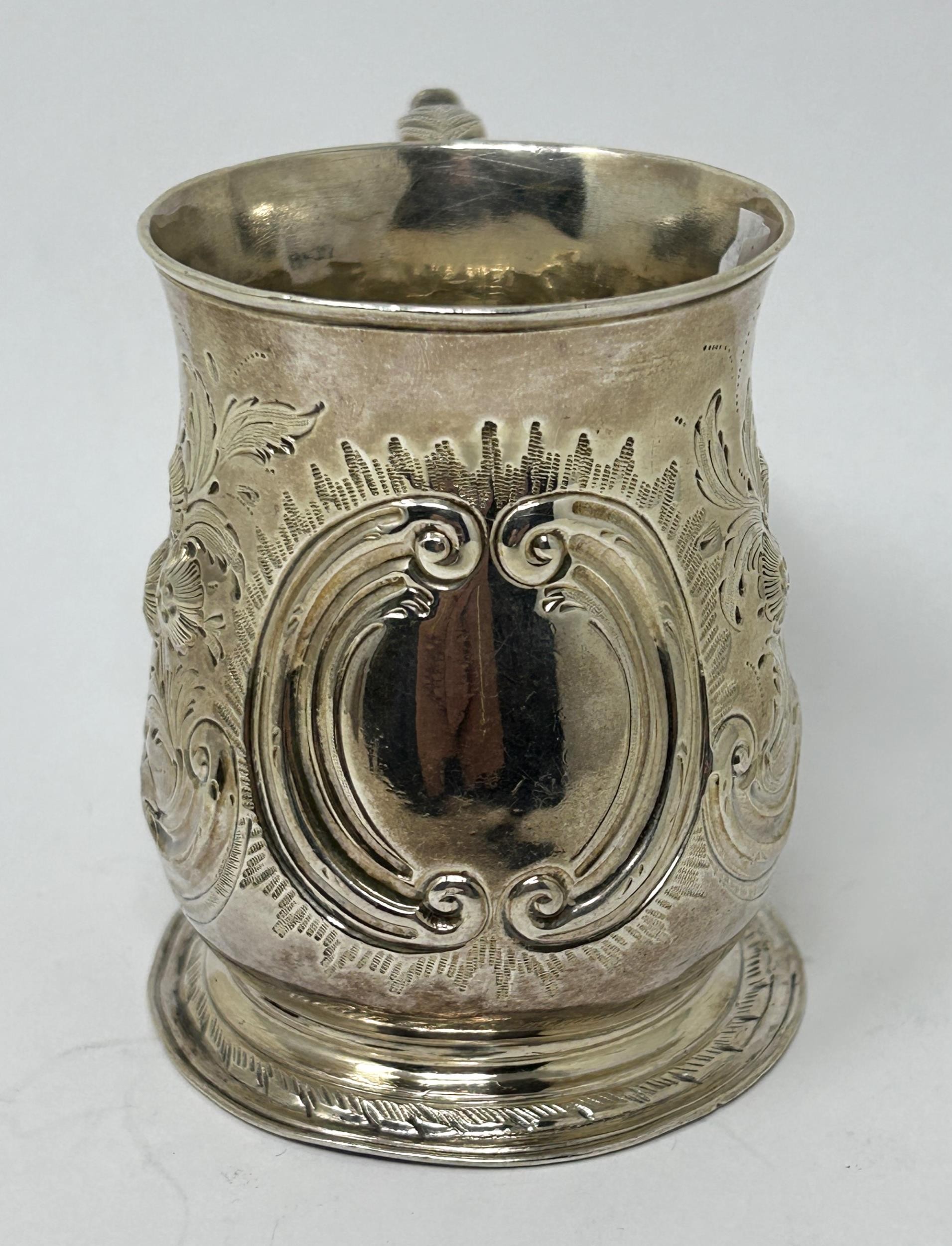 A George III silver mug, marks rubbed, later decorated, 5.1 ozt - Image 2 of 6