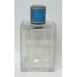 A silver, blue and white enamel topped glass perfume bottle, 12 cm high