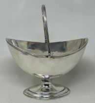 A George III silver swing handle sugar bowl, London 1786, 8.73 ozt