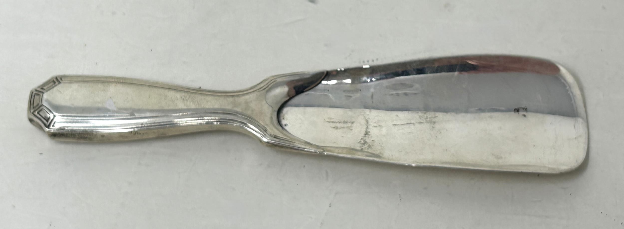 A Tiffany & Co sterling silver shoe horn, handle filled, all in 60 g