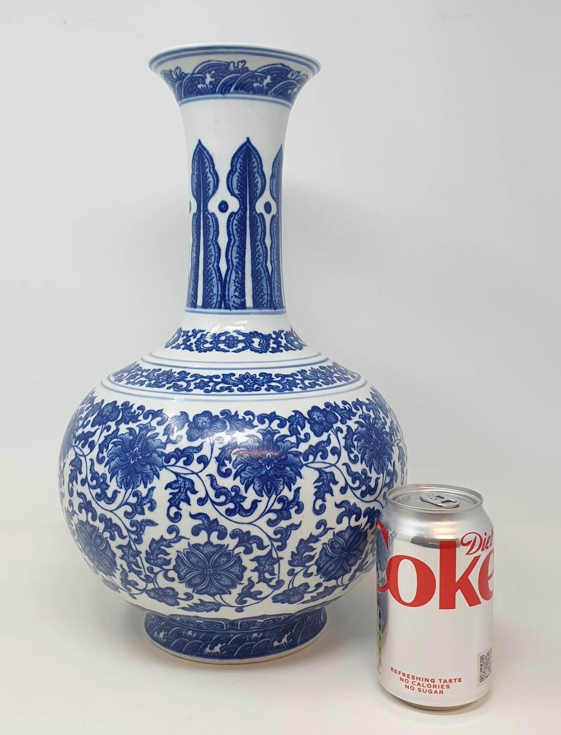 A Chinese blue and white bottle vase, decorated flowers in underglaze blue, bears a Qianlong mark, - Image 2 of 13