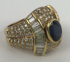 An 18ct gold, sapphire and diamond ring, ring size K