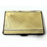 A George V silver and yellow enamel cigarette case, Birmingham 1932