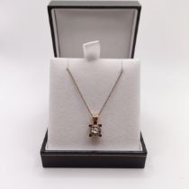 An 8ct gold and solitaire diamond necklace, boxed, diamonds 0.15ct