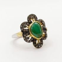 A silver-gilt ring, set with ovoid emerald and diamonds, mixed-cut emerald 1.58ct, rose-cut diamonds