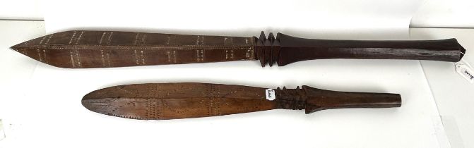 A carved Oceanic club, 107 cm, and another, 68 cm
