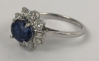 A sapphire and diamond cluster ring, ring size M