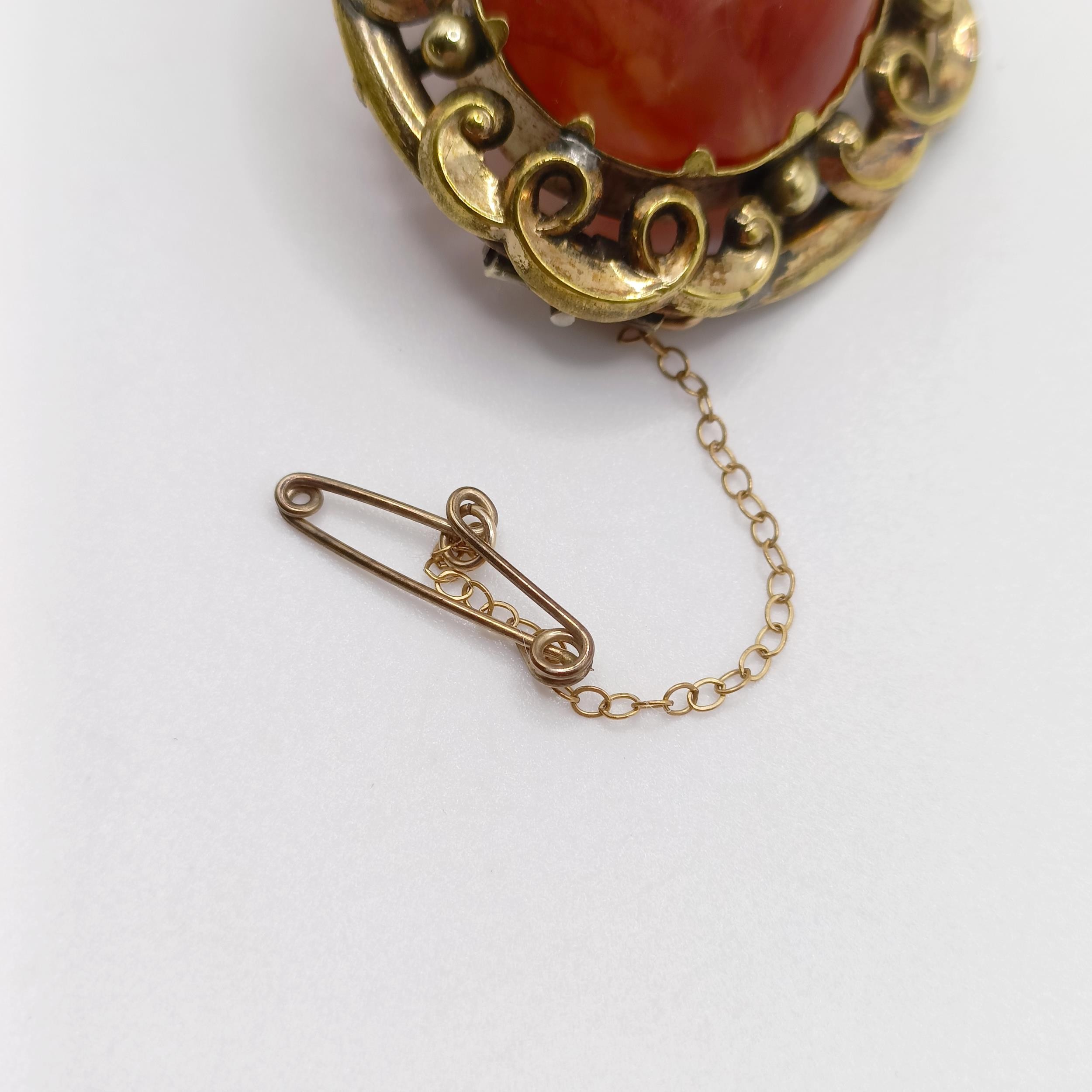 An early 20th century yellow coloured metal and amber coloured stone brooch, and a yellow metal - Image 6 of 6