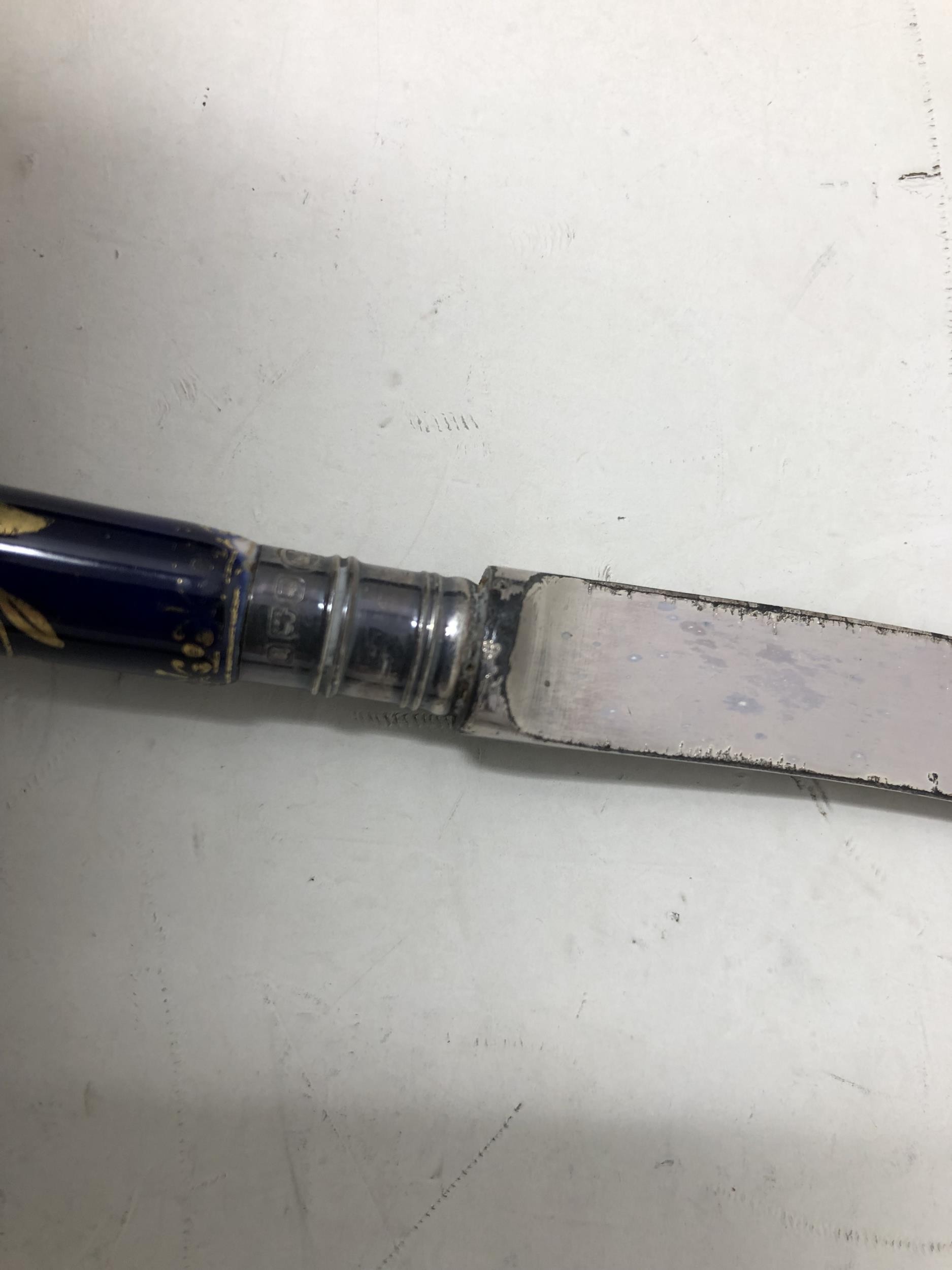 A set of six 19th century knives, with porcelain pistol handles, and silver sheaths, cased - Image 2 of 2