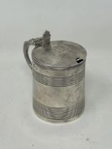 A George III silver mustard, in the form of a tankard, London 1807, 2.3 ozt, and an associated spoon