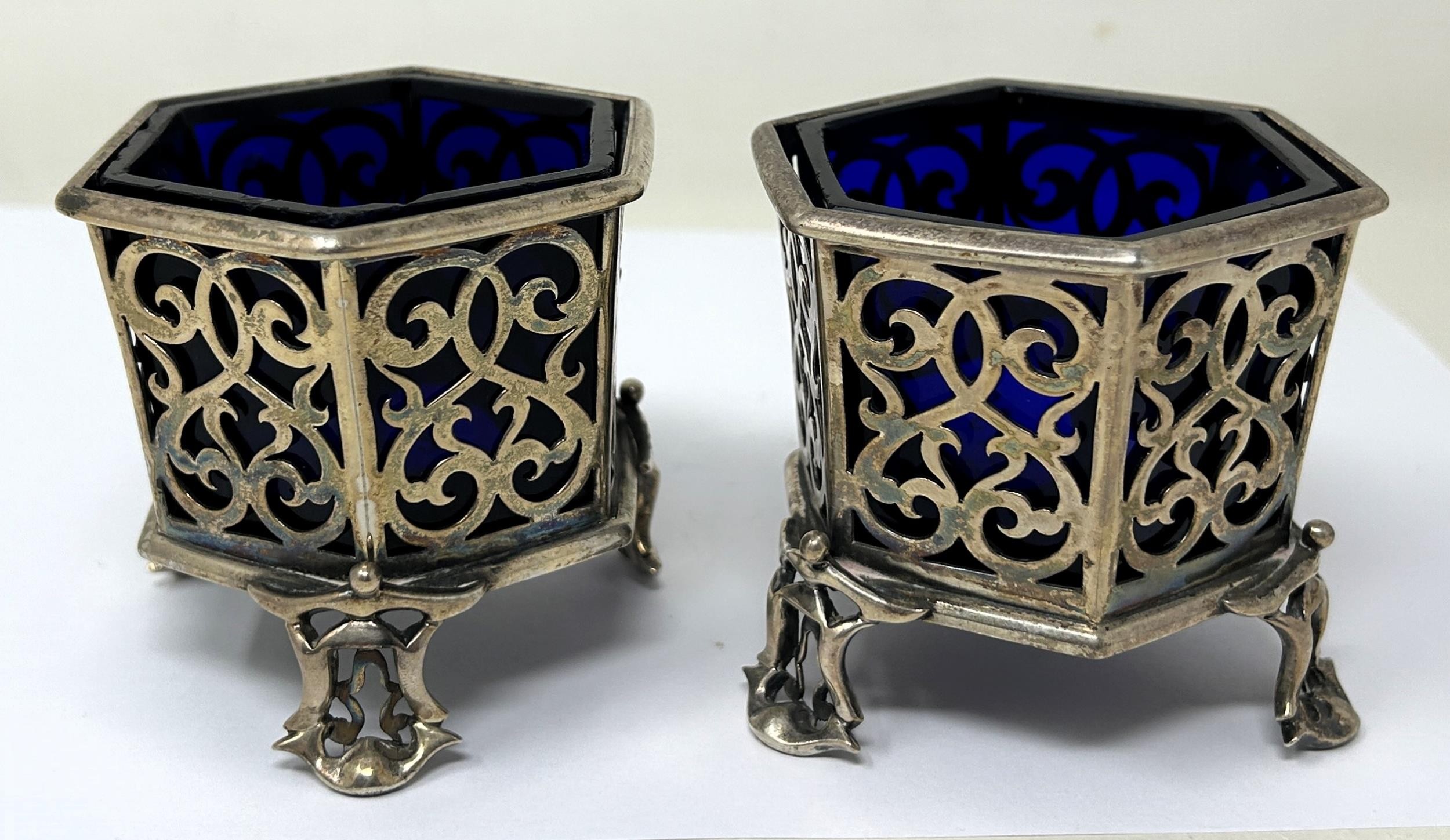 A pair of early Victorian hexagonal pierced silver salts, London 1840, 7.2 ozt, with blue glass