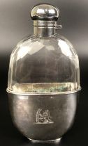 A silver coloured metal and cut glass hip flask