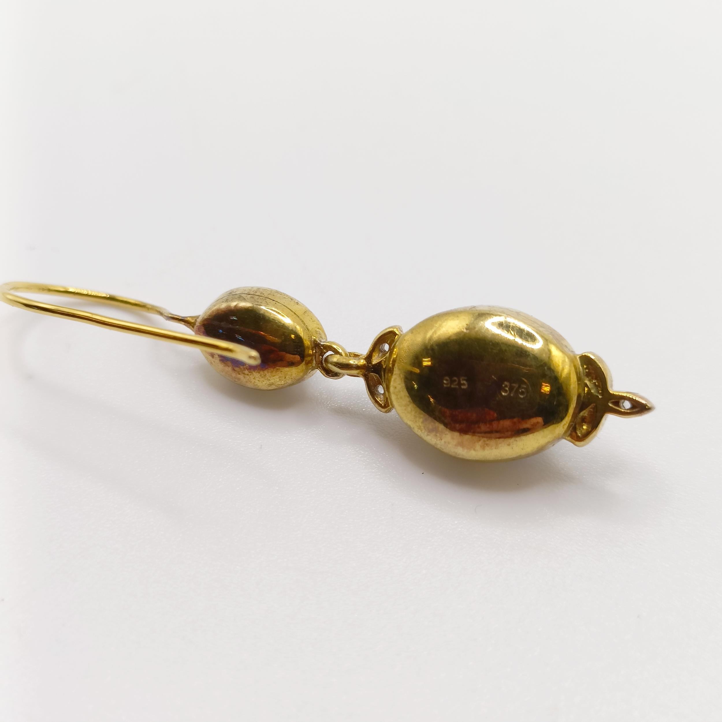 A pair of silver and 9ct yellow gold, cabochon garnet and diamond double drop earrings, with hook - Image 4 of 5