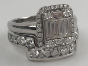 An 18ct white gold and diamond solitaire ring, ring size J, and a matching interlocking half