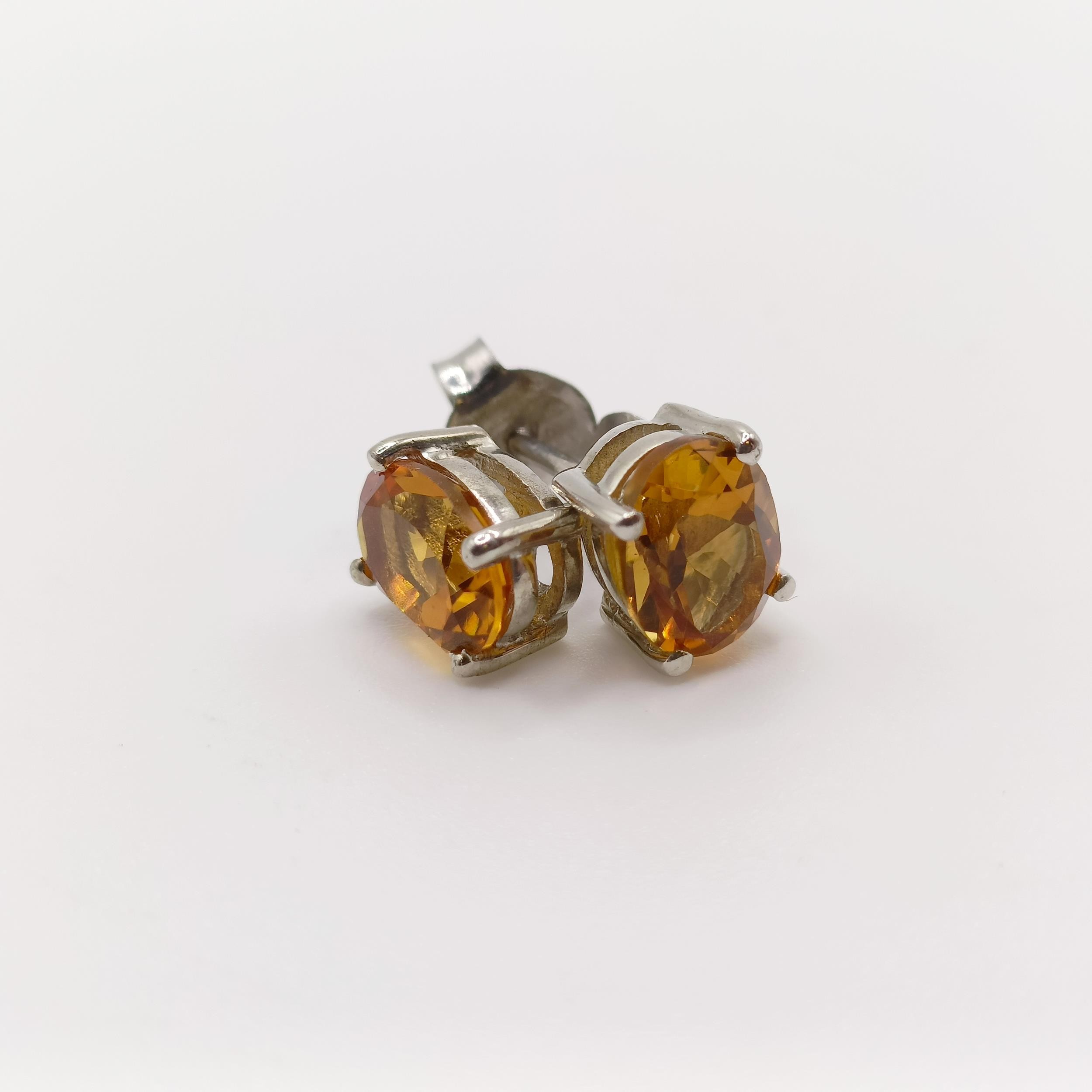 A pair of citrine studs, in silver